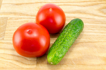 Cucumber and tomato with measuring