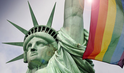 Statue of liberty in New York and rainbow flag 