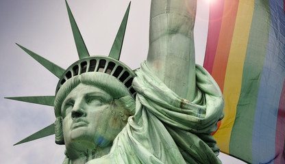 Statue of liberty in New York and rainbow flag 