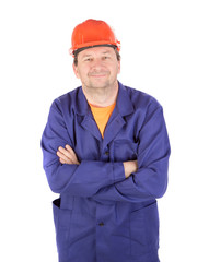 Man in working clothes with crossed arms.