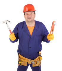 Worker in hard hat holding gas wrench.