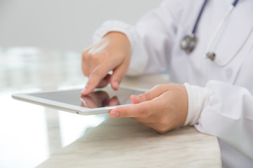 Doctor using tablet computer