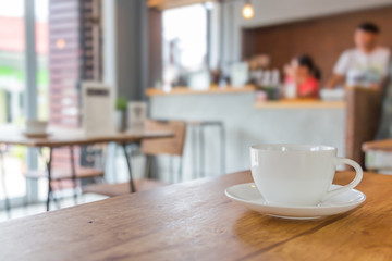 Coffee cup on table in cafe