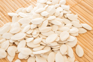 Pumpkin seeds on kitchen bamboo mat