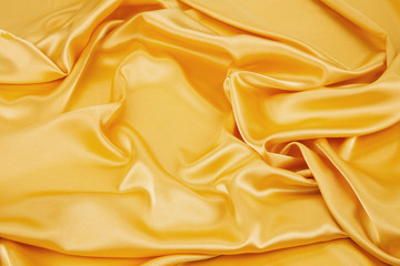 Close up of yellow silk cloth texture.