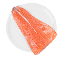 Raw salmon fillet on plate. Top view.