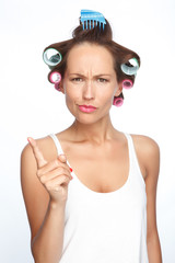 Portrait of a woman with hair rollers 