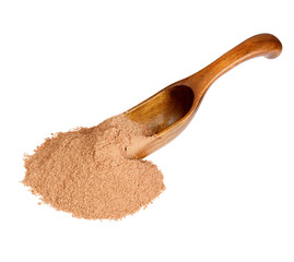 Ground Cinnamon in the wooden spoon, isolated on white backgroun