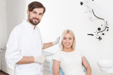 Fototapeta premium Portrait of smiling dentist and patient 