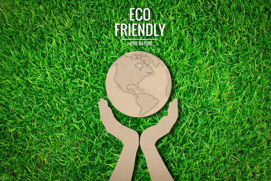 Paper Cut Of  Eco Friendly Earth On Green Grass