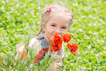 cute little girl holding a bouquet