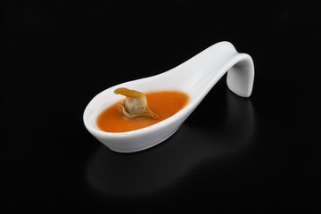 Cockle in red vegetable soup