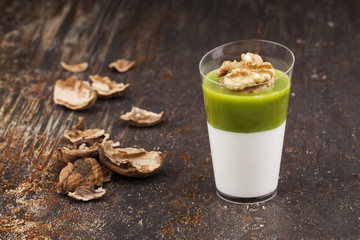 Shot of two-color layered creams with walnut