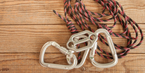 Mountain gear for climbing on wooden background
