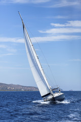 Obraz premium Boat competitor of sailing regatta, clear sunny weather. Luxury yachts.