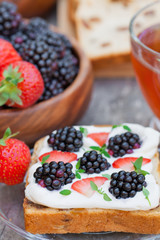 toast with cream cheese and fresh berries