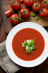 Top view of gazpacho in a glass plate, close-up, studio shot