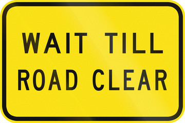 An Australian warning traffic sign - Wait till road clear