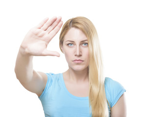 Fototapeta premium Attractive blonde woman with her hand holding it at arm's length.