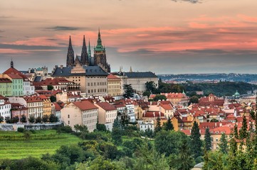Fototapeta premium Prague castle and roofs of buildings in Prague during sunset