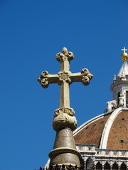 Christian cross with Basilica in background