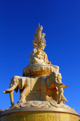 Fototapeta na wymiar Samantabhadra statue with blue sky