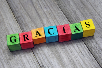 word gracias (thank you in Spanish) on colorful wooden cubes