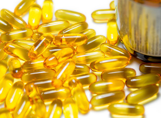 Fish oil pills with brown  bottle isolated
