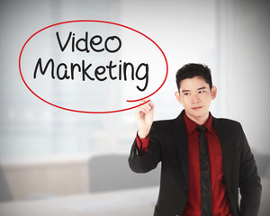 Business man writing video marketing