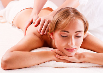 Fototapeta na wymiar Beautiful young woman getting spa massage