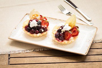 Fruit tarts on a wooden background