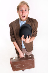 Lost terrified traveler man with a old suitcase