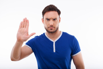 Handsome young man is refusing to do something