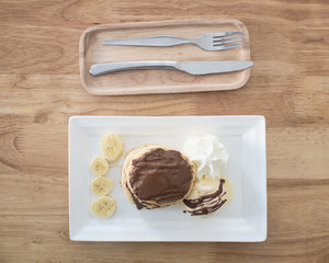 pancake and vanilla ice cream with chocolate syrup topping