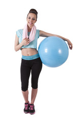 girl in the gym with ball and towel