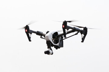Fototapeta na wymiar drone flying in white background, from below angle