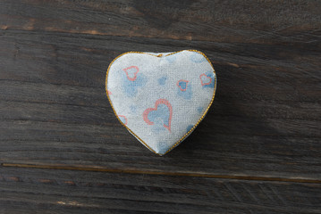Heart shaped Valentines Day gift box on wood