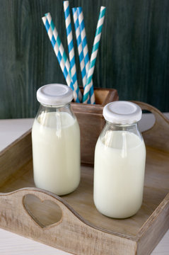 Two old fashioned milk bottles