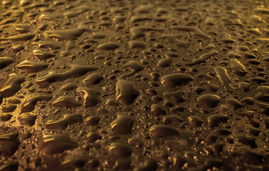 Gold glass with natural water drops