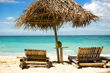 Beach chairs on beautiful sand beach