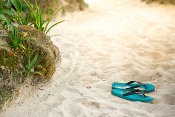 slippers on the sandy beach