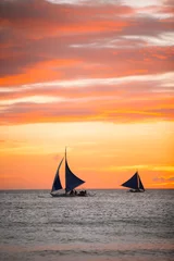 Poster de jardin Mer / coucher de soleil Sailing boats with a beautiful sunset at the sea