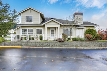 Large modern house with two garage spaces.