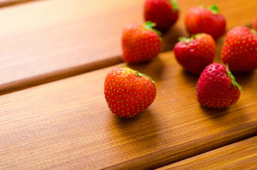Fresh ripe red strawberries on wooden table