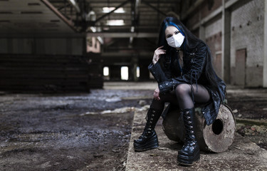 Fototapeta na wymiar Gothic girl in the image of an abandoned factory