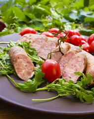 Smoked sausage with greens and tomatoes 