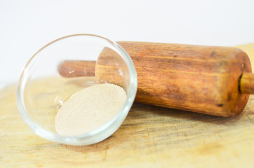 yeast in glass bolw with wooden roller