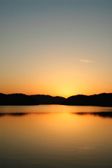 blue and orange gradation of sunset on the JINYANG lake
