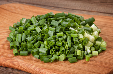 The cut fresh onions on the board