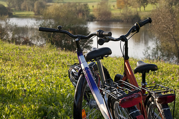 a couples bikes on a lake